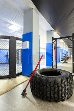 Photo for Close-up of a weight training gym with a huge wheel and hammer - Royalty Free Image