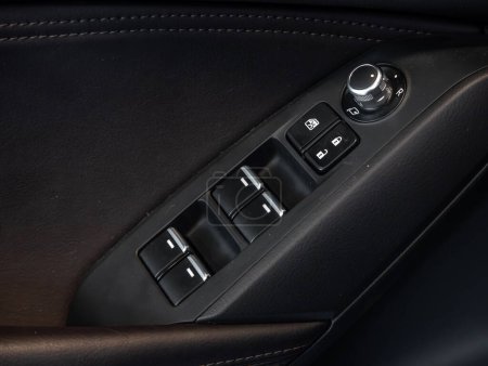 Photo for Novosibirsk, Russia - February  20 , 2024:  Mazda CX-4 ,  close-up of the side door buttons: window adjustment buttons, door lock - Royalty Free Image