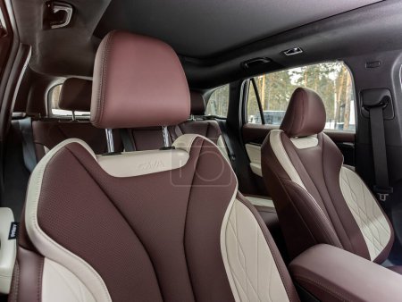 Photo for Novosibirsk, Russia - March  22 , 2024:  Geely Monjaro, Close-up   brown and beige leather   passenger seats. Luxury car interior - Royalty Free Image