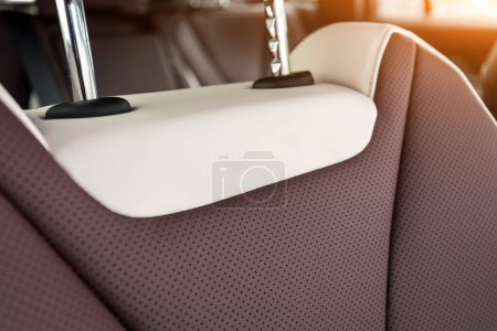 Close-up    white and brown  headrest driver's seat made of genuine leather 