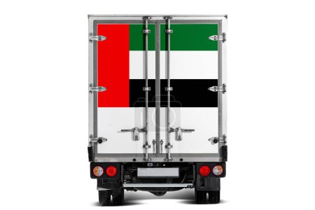 Photo for A truck with the national flag of United Arab Emirates  depicted on the tailgate drives against a white background. Concept of export-import, transportation, national delivery of goods - Royalty Free Image