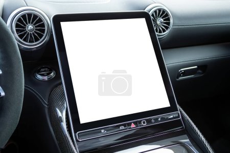 Foto de Primer plano de un panel de coche con un monitor blanco para botones de diseño, radio, reproductor y control. - Imagen libre de derechos