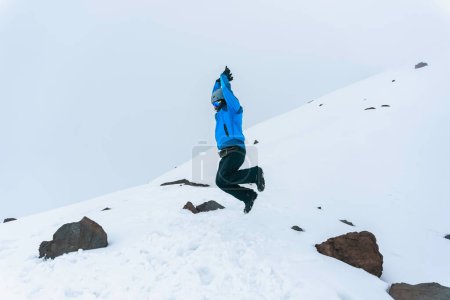 Photo for A hiker man jumping on the base of chimborazo Mountain in ecuador - Royalty Free Image