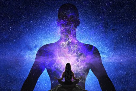 Photo for Woman doing yoga in front of giant silhouette of man with universe - Royalty Free Image
