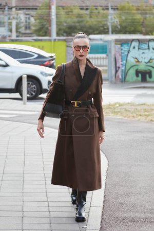 Photo for MILAN, ITALY - SEPTEMBER 23, 2022: Mary Leest with brown coat before Tods fashion show, Milan Fashion Week street style - Royalty Free Image