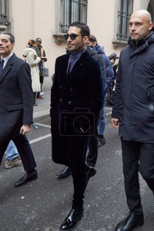 Photo for MILAN, ITALY - JANUARY 16, 2023: Miguel Angel Silvestre before Giorgio Armani fashion show, Milan Fashion Week street style - Royalty Free Image