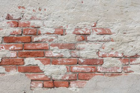 Téléchargez les photos : Old brick wall and ruined plaster texture background - en image libre de droit