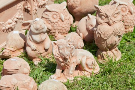 Photo for CARAVINO, ITALY - APRIL 28, 2023: Terracotta pets sculptures in spring during Tre Giorni per il Giardino fair at Masino Castle near Turin, Italy. - Royalty Free Image