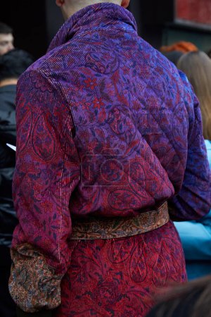 Photo for MILAN, ITALY - FEBRUARY 22 , 2024: Man with velvet padded jacket with paisley design before Max Mara fashion show, Milan Fashion Week street style - Royalty Free Image