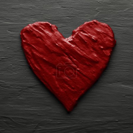 Foto de Red heart on rough slate like bakcground - Imagen libre de derechos