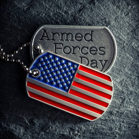 Photo for US military soldier's dog tags engraved with Armed Forces Day text and in the shape of the American flag. - Royalty Free Image