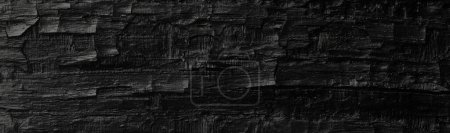 Photo for Dark black background of rough burnt wood, soot, and ash. Burn texture. - Royalty Free Image