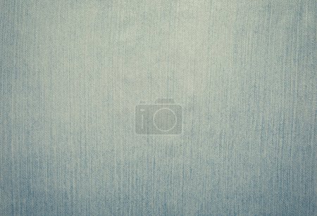 Photo for Worn and weathered blue jeans denim material background. - Royalty Free Image