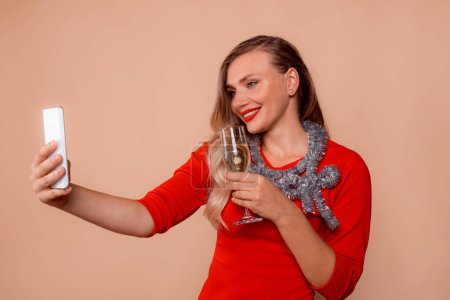 Photo for Smiling woman with champagne glass watching phone. webcam making congratulation video call - Royalty Free Image