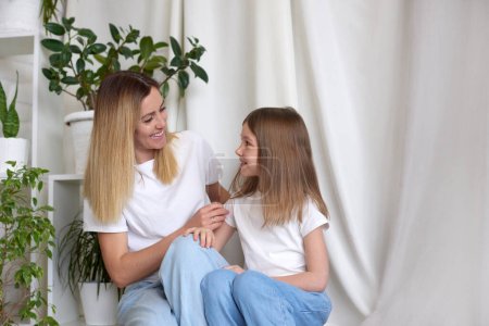Photo for Young mother talking communicates with daughter. Best friends happy motherhood weekend together with kid concept - Royalty Free Image