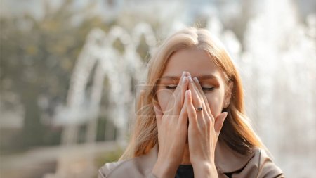 Photo for Young woman allergic suffers from allergy outdoor walking on city street - Royalty Free Image