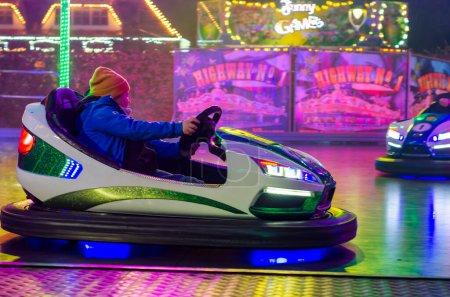 Photo for Soest, Germany - November 04, 2022: People riding bumper cars at  at the fair. - Royalty Free Image