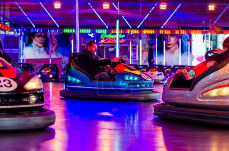 Photo for Soest, Germany - November 04, 2022: People riding bumper cars at  at the fair. - Royalty Free Image