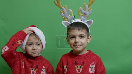 Photo for Naughty brothers inviting santa to come. Dancing and making funny face expressions. High quality photo - Royalty Free Image