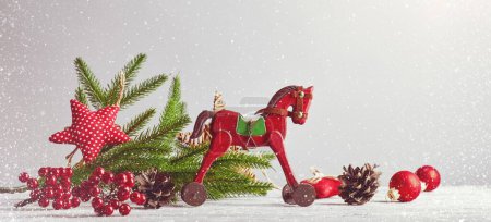Photo for Christmas card with vintage wooden horse decoration for christmas tree and garland at old board. - Royalty Free Image