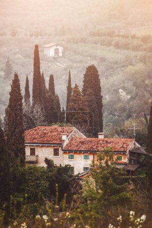 Photo for Picturesque view with hill at old authentic italian house. Verona Italy. - Royalty Free Image