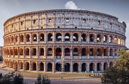 Photo for Rome, Italy. Roman Colosseum (Coliseum or Colosseo) ancient ruins of Flavian Amphitheatre. Arena for gladiator fightings. World famous landmark and very popular touristic destination vacation trip - Royalty Free Image