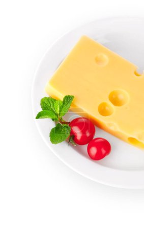 Photo for Yellow cheese with red tomatoes and green mint leaves on the whi - Royalty Free Image