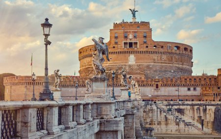 Photo for Rome, Italy. Castel Saint Angelo or Mausoleum of Hadrian. Ancient Roman architecture and statues Angels Demons, street lanterns. Sunset view. - Royalty Free Image