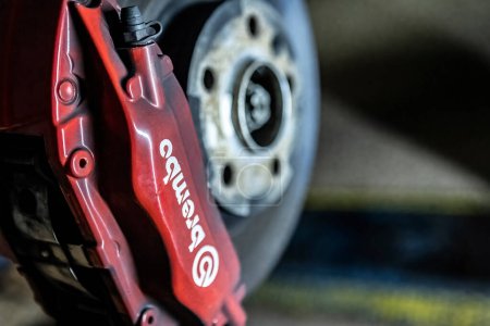 Photo for Milan, Italy 29 October 2022: Brembo disc brake sport car detail workshop maintenance - Royalty Free Image