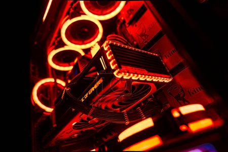 Photo for Milan, Italy 14 april 2023: Get a glimpse of the latest technology with a close-up of the NVIDIA GeForce RTX 4070 Ti GPU in an illuminated gaming PC setup. Rog Strix custom. - Royalty Free Image