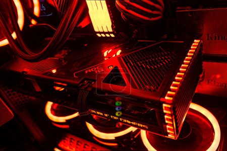 Photo for Milan, Italy 14 april 2023: Get a glimpse of the latest technology with a close-up of the NVIDIA GeForce RTX 4070 Ti GPU in an illuminated gaming PC setup. Rog Strix custom. - Royalty Free Image