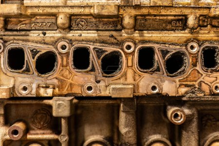 Photo for A photo showing dirty intake manifolds in a car engine, impacted by exhaust gas recirculation (EGR) effects. - Royalty Free Image