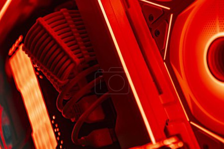 Sleek gaming PC with illuminated fans showcasing high-performance internals.