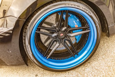 Photo for Vicenza, Italy 19 March 2024: Detailed close up view of a blue rim on a car, showcasing the intricate design and color of the wheel. - Royalty Free Image