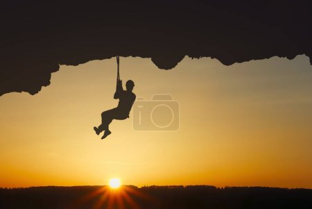 Photo for Man rock climber silhouette, adventure experiences concept - Royalty Free Image