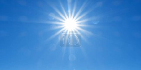 Foto de El sol blanco irradia su brillo desde el centro de un vasto cielo azul, ideal para varios proyectos creativos - Imagen libre de derechos