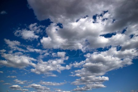 Photo for Photographic documentation of the passage of a group of clouds in a blue sky - Royalty Free Image