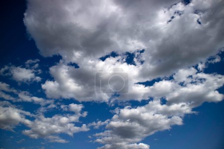 Photo for Photographic documentation of the passage of a group of clouds in a blue sky - Royalty Free Image