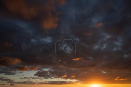 Photo for Photographic documentation of dark clouds during the sunset phase - Royalty Free Image