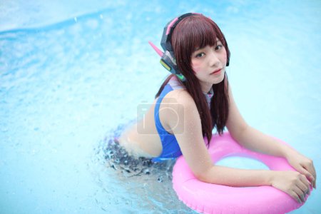 Photo for Portrait of Japan anime cosplay girl with swim suit at swimming pool - Royalty Free Image