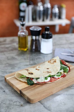 Photo for Italian cuisine , Piadina with Italian ham and cheese - Royalty Free Image