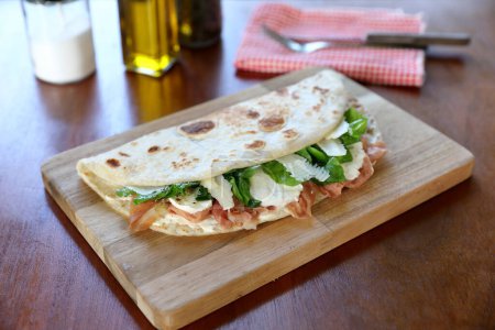 Photo for Italian cuisine , Piadina with Italian ham and cheese - Royalty Free Image