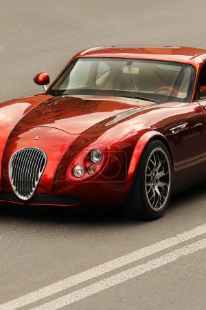 Photo for Kiev, Ukraine - June 12, 2021: Wiesmann GT MF4. Sports red exclusive car on the road - Royalty Free Image