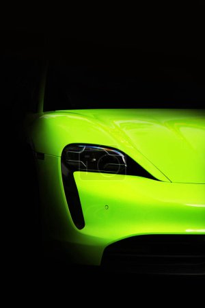 Téléchargez les photos : Kiev, Ukraine - June 19, 2021: Matte Porsche Taycan Turbo S lime color in the shade - en image libre de droit