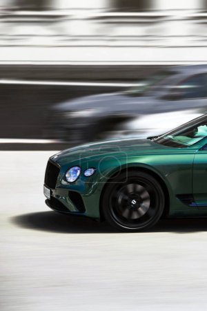 Photo for Kiev, Ukraine - June 19, 2021: Luxury British Bentley Continental GT car in motion. Blurred car. Supercar at high speed - Royalty Free Image