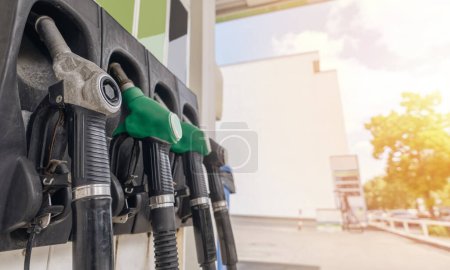 Photo for Close up of diesel and petrol fuel pistols at a gas station. The fuel crisis continues and the cost of fuel is going up - Royalty Free Image