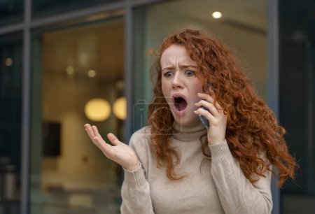 Photo for Portrait of a young woman talking in anger on her mobile to her boyfriend about ending their relationship - Royalty Free Image