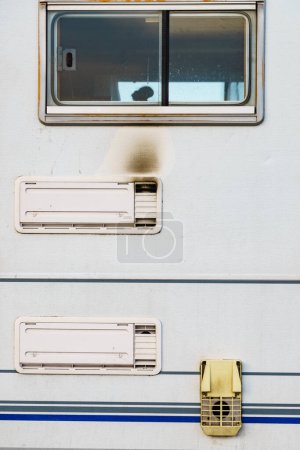 Photo for Camper car detail. Grid, fridge ventilation plate blackened by smoke. Gas problem. - Royalty Free Image