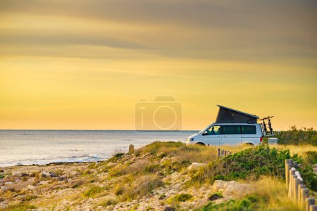 Photo for Van camper with roof top tent camping on mediterranean coast. Holidays and travel in mobile home. Van life. - Royalty Free Image