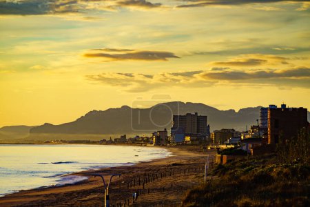Photo for Seascape at morning, beach in Gandia. Montgo mountain massif silhouetted on horizon. Valencia Spain. - Royalty Free Image